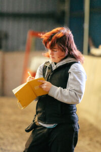 Learner taking detailed notes during the Essential Canine Life Skills Spirit Dog Trainer Course, accredited by Skills and Education Group Awards.
